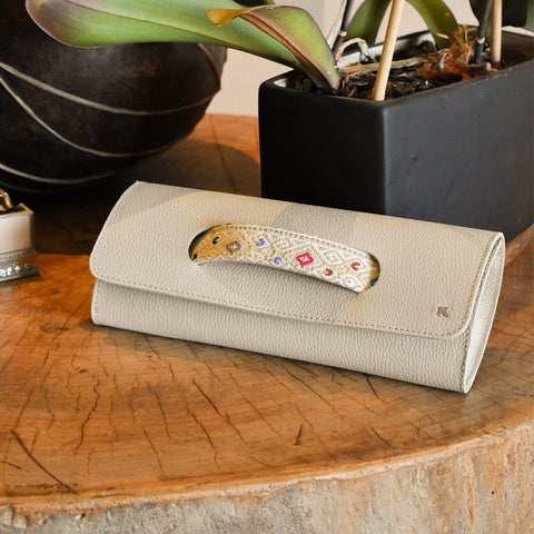Bolsa clutch con brocado